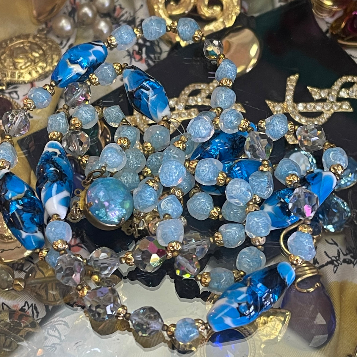 Suspension design boule en verre avec finition dorée argentée