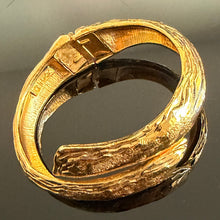 Load image into Gallery viewer, Pretty vintage hinged gilded metal bracelet signed YSL
