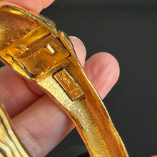 Load image into Gallery viewer, Pretty vintage hinged gilded metal bracelet signed YSL
