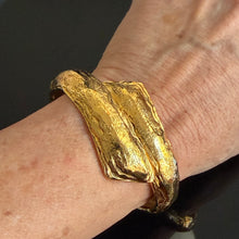 Load image into Gallery viewer, Pretty vintage hinged gilded metal bracelet signed YSL
