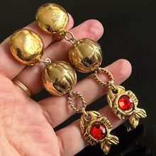 Load image into Gallery viewer, Long vintage-style dangling fish-pattern clip-on earrings in gold-tone metal with red rhinestones
