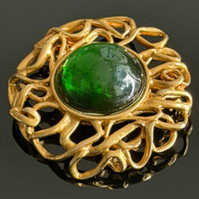 Load image into Gallery viewer, Beautiful large vintage couture brooch in gold-tone metal with a green resin cabochon, signed YSL
