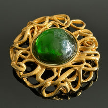 Load image into Gallery viewer, Beautiful large vintage couture brooch in gold-tone metal with a green resin cabochon, signed YSL
