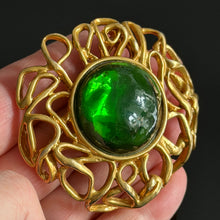 Load image into Gallery viewer, Beautiful large vintage couture brooch in gold-tone metal with a green resin cabochon, signed YSL
